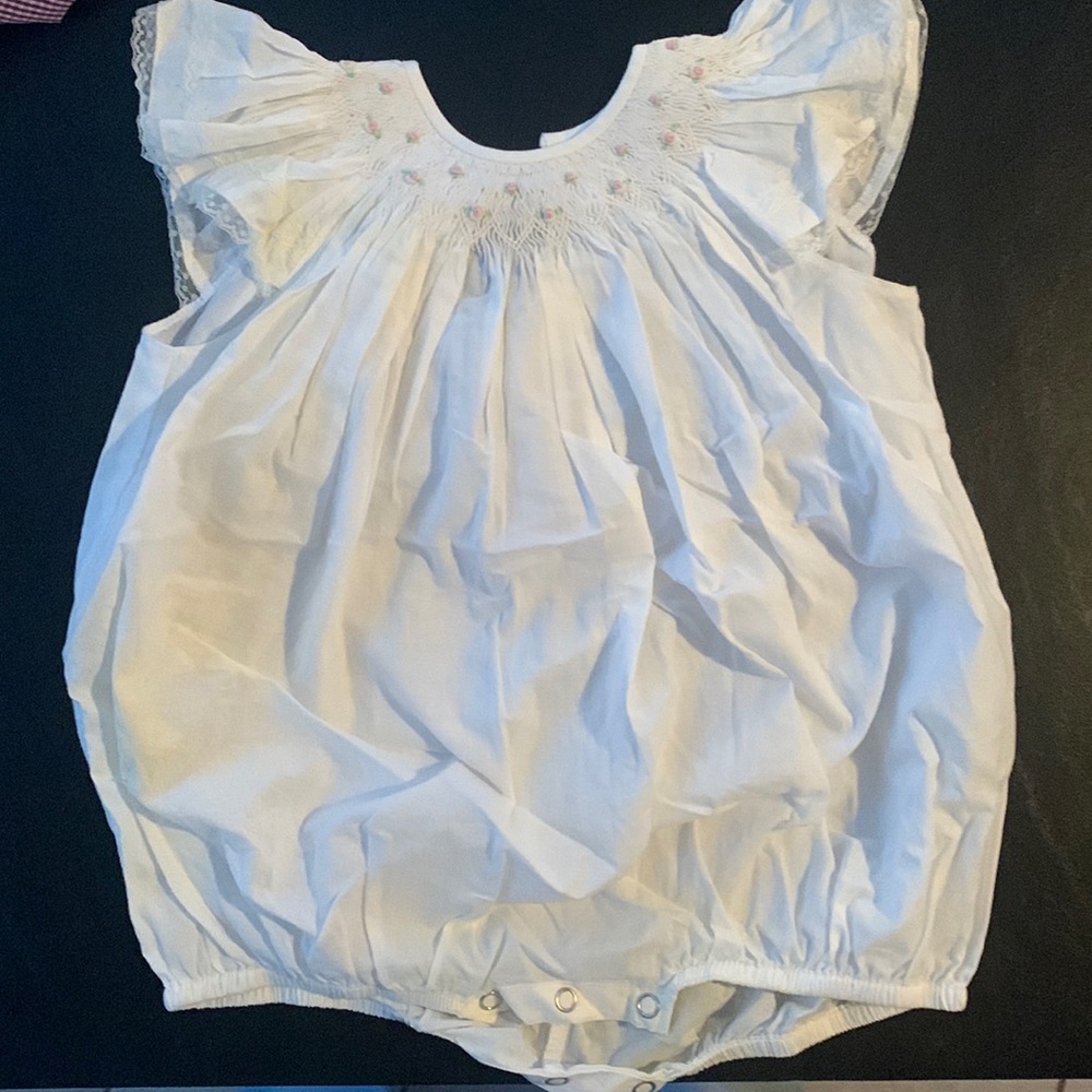 12 month White smocked onesie.